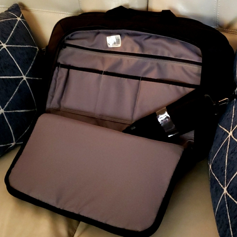 Polyester black 15.6 size laptop case with shoulder strap.